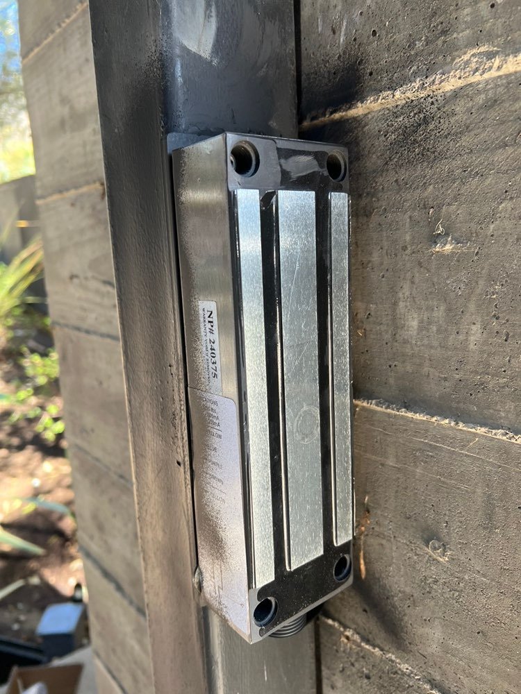 Magnetic lock installed on a steel pedestrian gate post by A1 Security Gate & Intercom